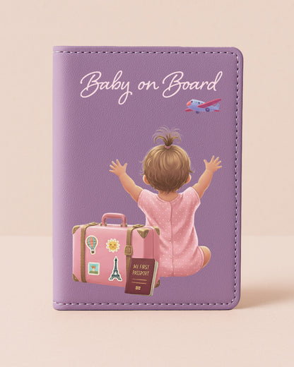 Purple card with illustration of a baby on a suitcase and 'Baby on Board' text on a beige background