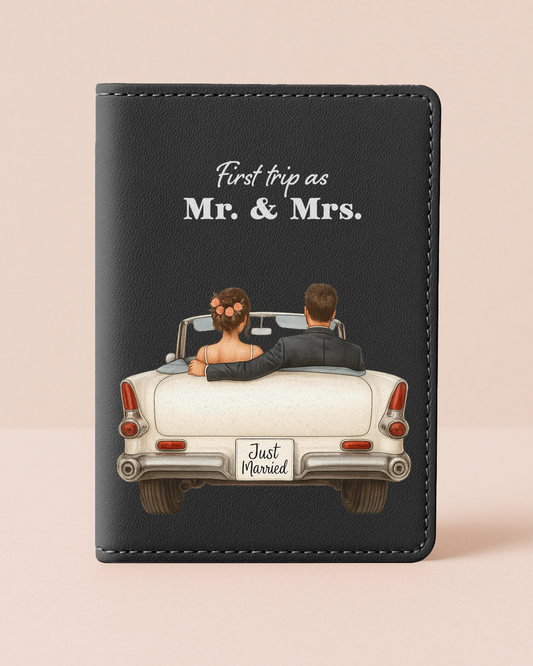 Black leather wallet with an illustration of a couple in a convertible car and text 'First trip as Mr. & Mrs.